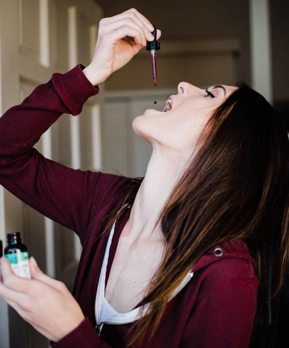 Lady taking Vimergy b-12 supplements